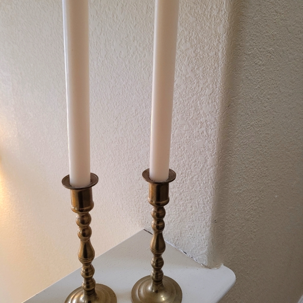 A pair of brass candlestick holders